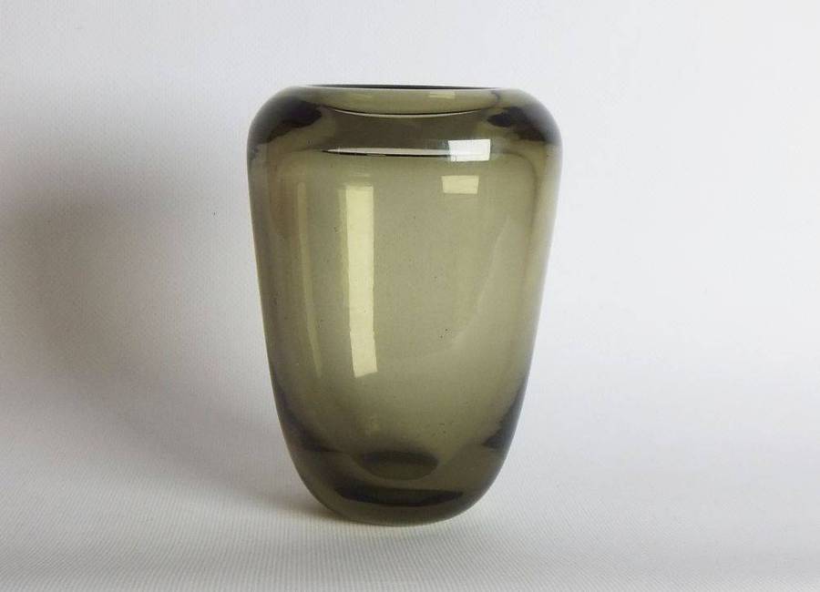 A heavy vintage Holmegaard style glass vase with polished base
