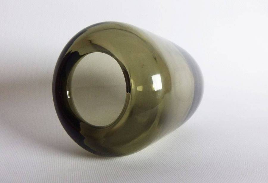 A heavy vintage Holmegaard style glass vase with polished base