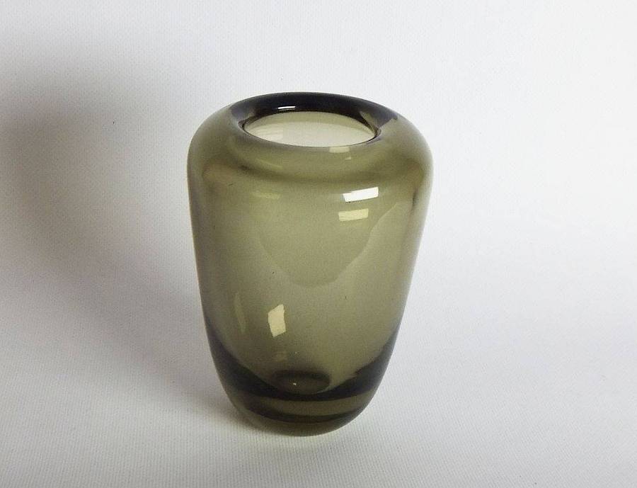 A heavy vintage Holmegaard style glass vase with polished base