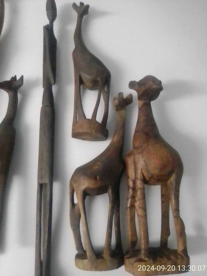 AFRICAN HAND CARVED WOODEN GIRAFFES AND FIGURINE.
