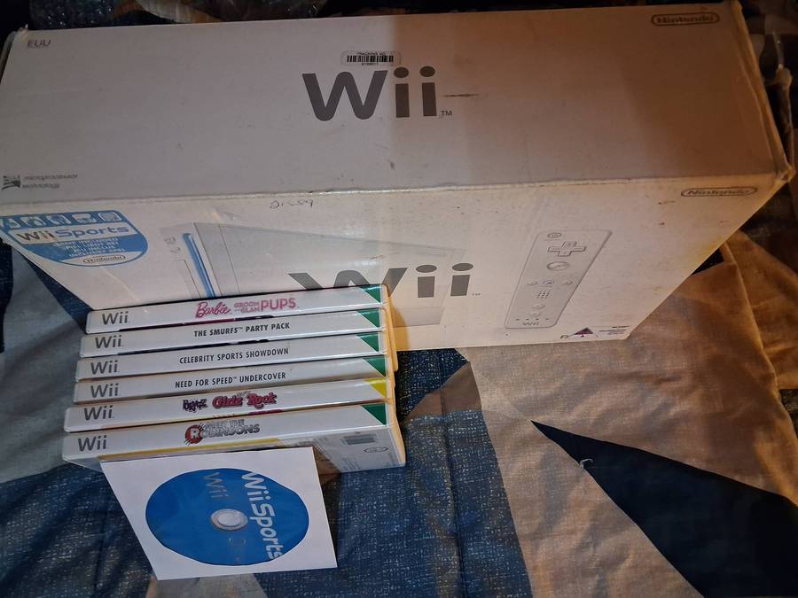 Nintendo Wii in box with 7 games