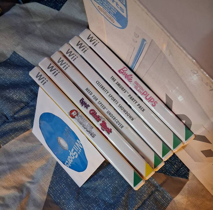 Nintendo Wii in box with 7 games