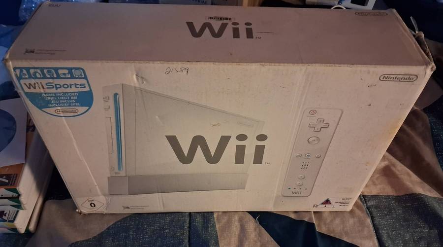 Nintendo Wii in box with 7 games