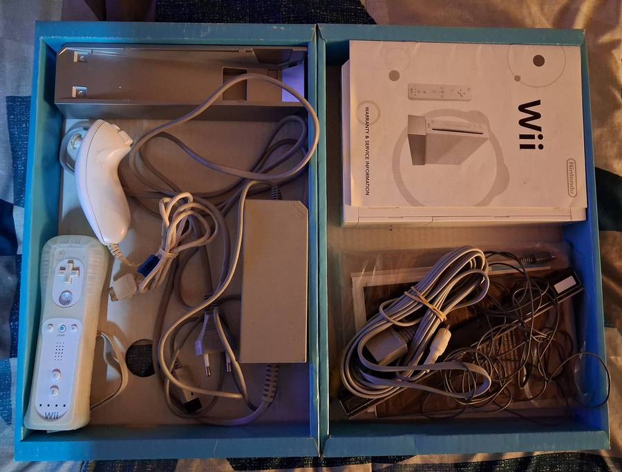 Nintendo Wii in box with 7 games