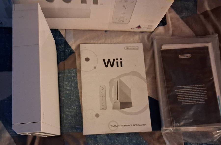 Nintendo Wii in box with 7 games