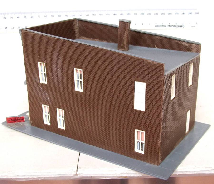 SCENERY HO:  On Auction is this European Plastic Multi Story Building in Fair Used Condition.