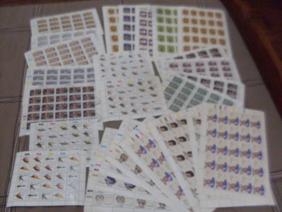 26 FULL STAMP  SHEETS ...MINT/POSTAL STAMPED