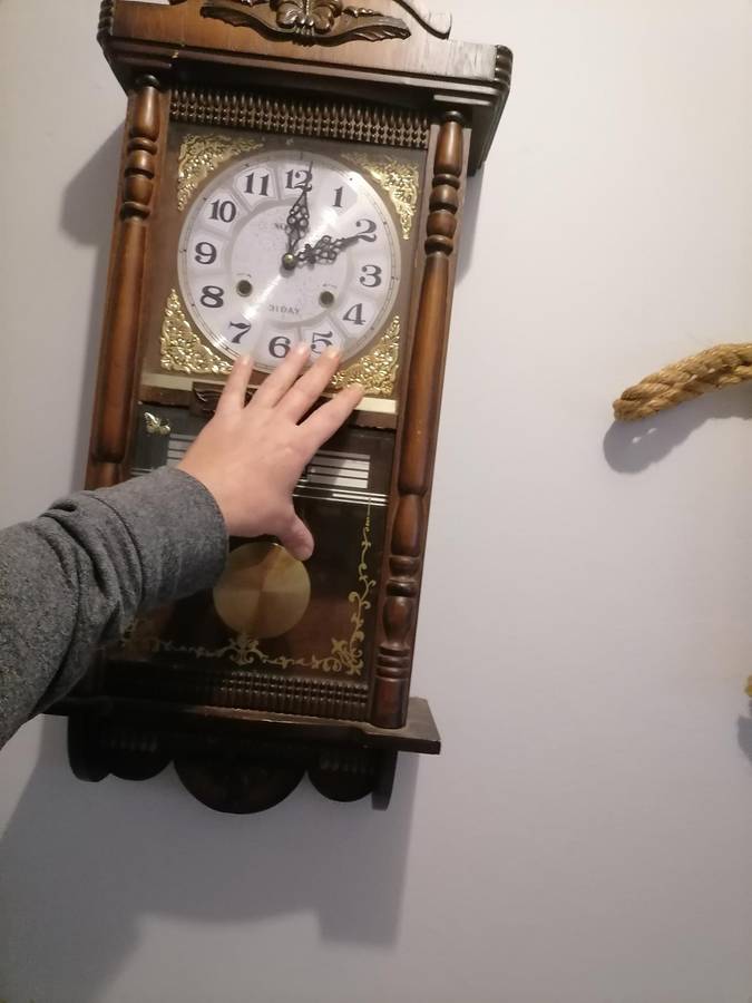 A vintage Blessing 31 day clock w/ day & date in a wood wall casing. Lifespace Sale - With Key