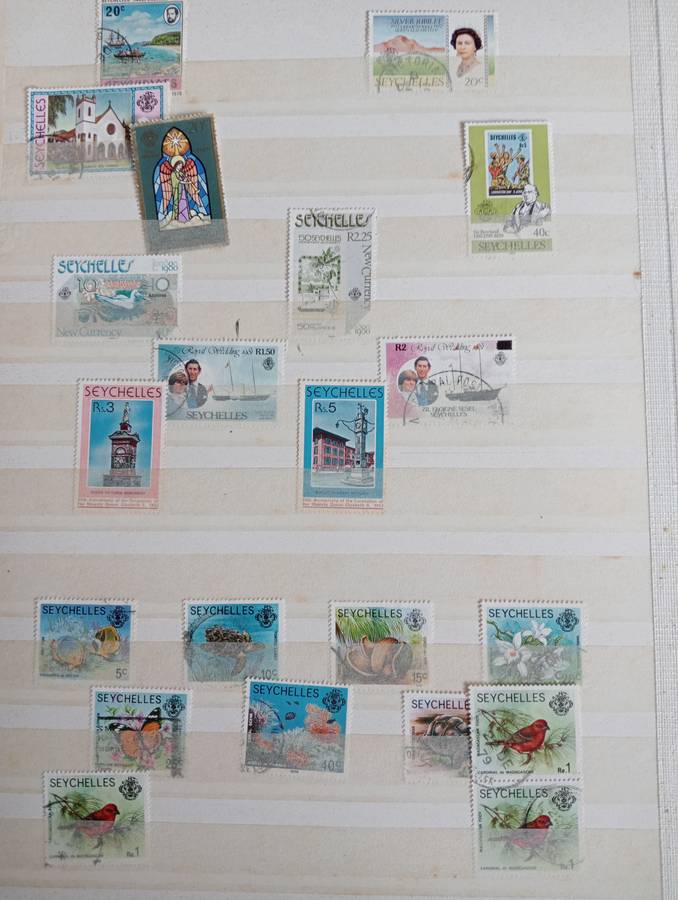 MAURITIUS AND SEYCHELLES IN A STOCK BOOK-MANY EARLY USEFUL,KGVI SEYCHELLES HAS TONING -CONDITION ISS