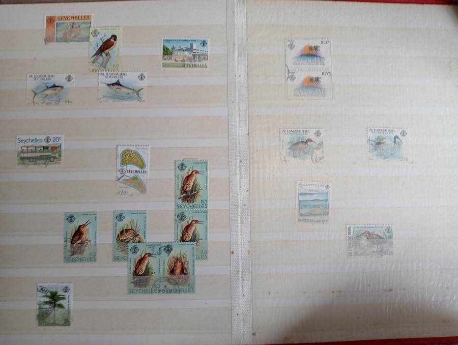 MAURITIUS AND SEYCHELLES IN A STOCK BOOK-MANY EARLY USEFUL,KGVI SEYCHELLES HAS TONING -CONDITION ISS