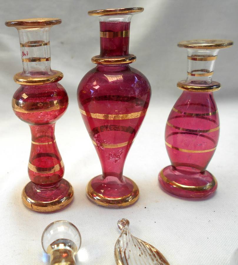 STUNNING three MINIATURE ROSE COLOUR EGYPTIAN GLASS PERFUME BOTTLES WITH DAPPERS