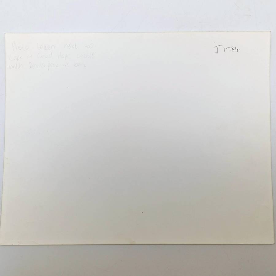 Antique photo reprint of horse cart next to Castle of Good Hope wall with Devils Peak in back