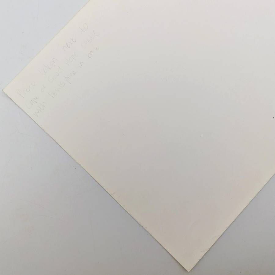 Antique photo reprint of horse cart next to Castle of Good Hope wall with Devils Peak in back