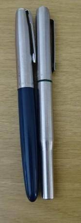 TWO FOUNTAIN PENS. BLUE ONE IS A PARKER