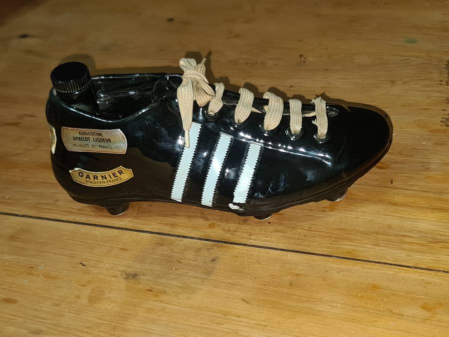 Liquor bottle in the shape of a rugby boot