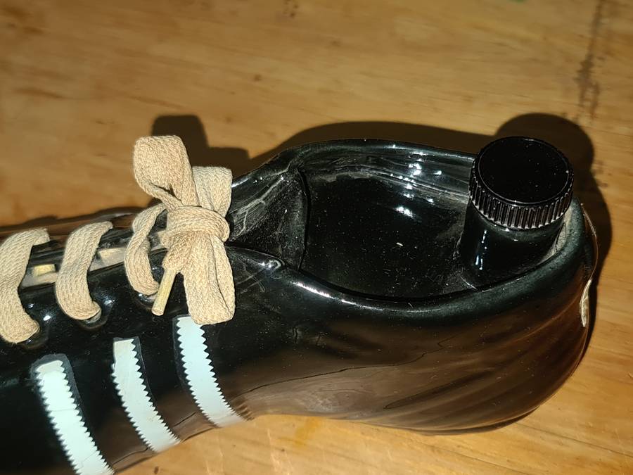 Liquor bottle in the shape of a rugby boot