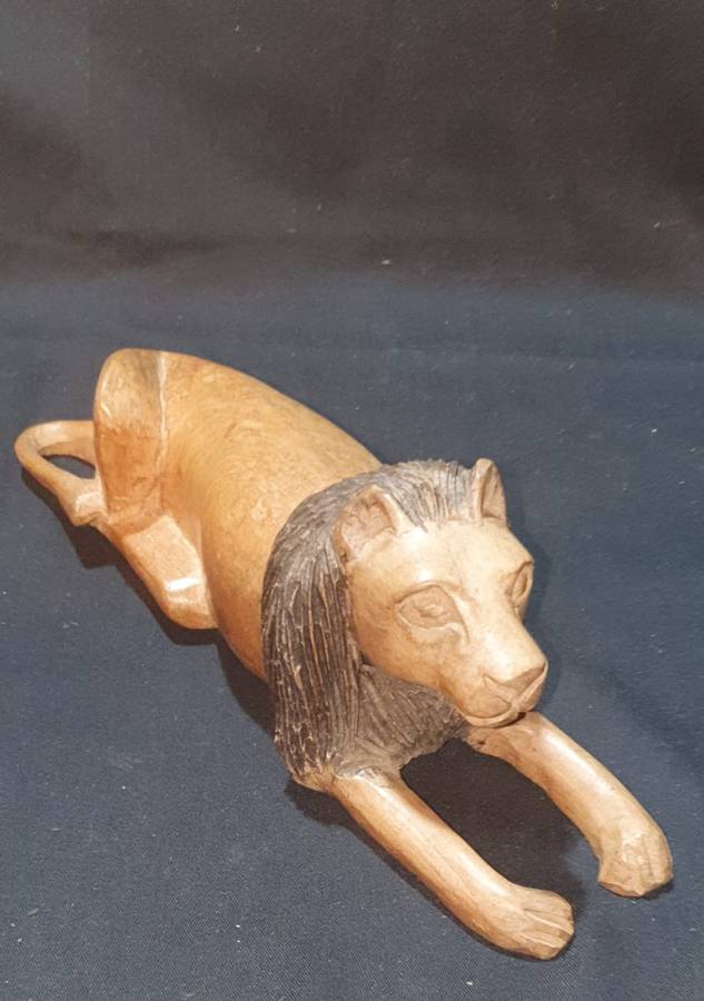 Carved wooden lion figure