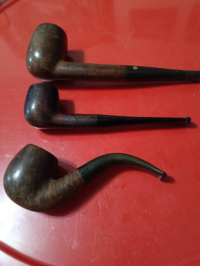 THREE SMOKING PIPES.