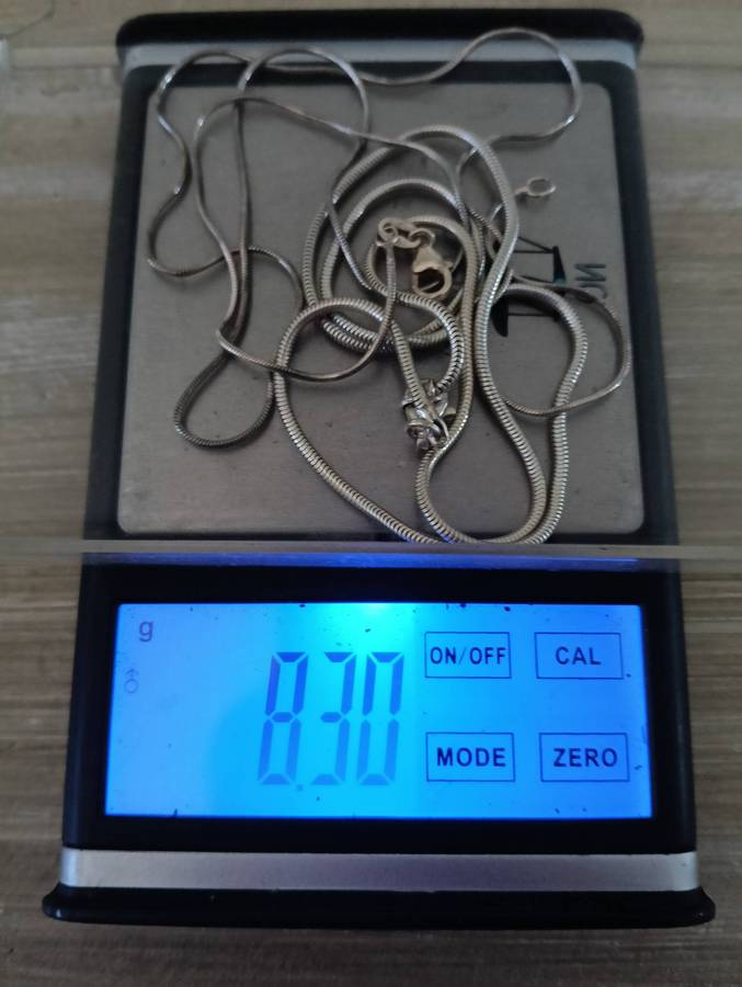 SILVER NECKLACES, WITH CLAW PENDANT.