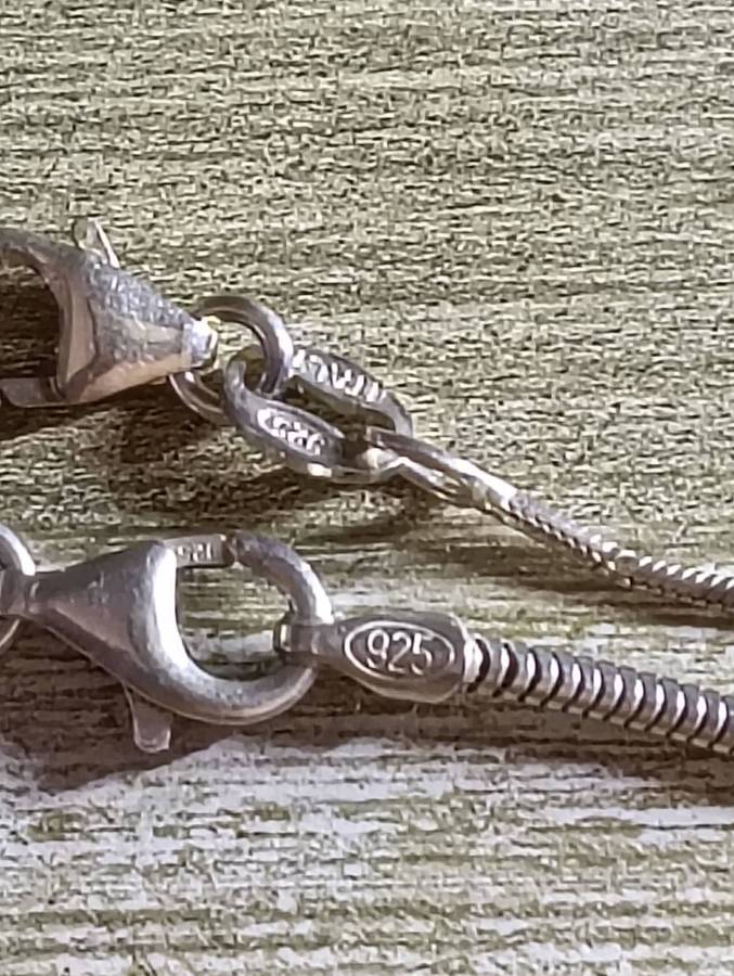 SILVER NECKLACES, WITH CLAW PENDANT.