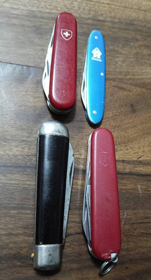 FOUR POCKET KNIVES. SWITZERLAND AND ENGLAND.