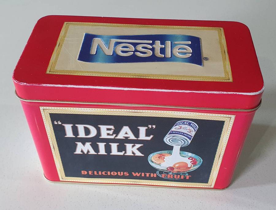 NESTLE tin as per photos