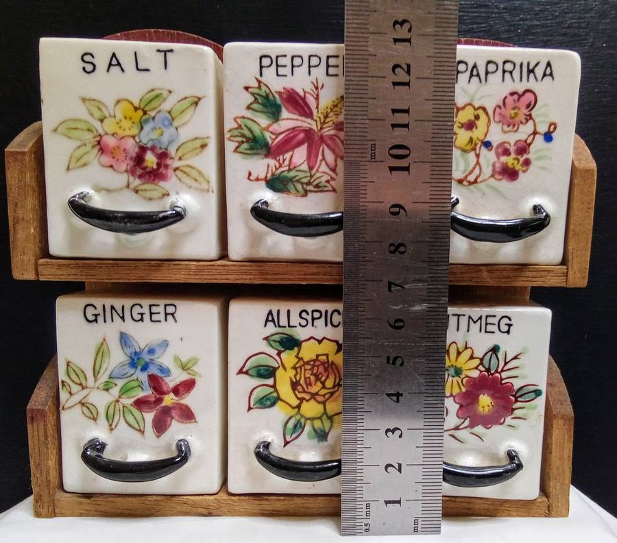 Lovely vintage spice rack with porcelain canisters