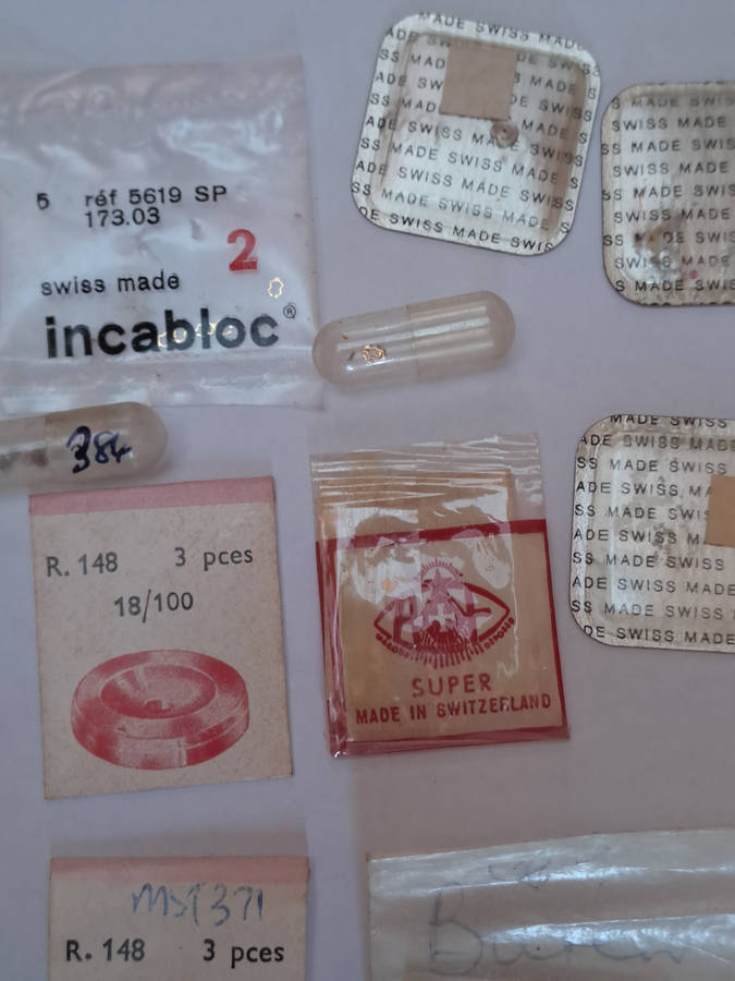 Lot of watch spares jewels springs settings Incabloc Favotite etc as per pictures