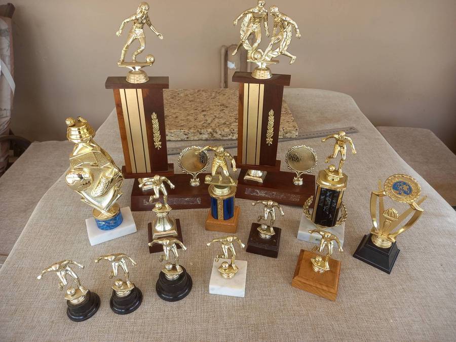 Collection of 13 soccer trophies