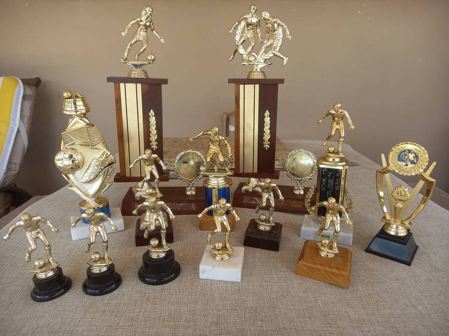 Collection of 13 soccer trophies