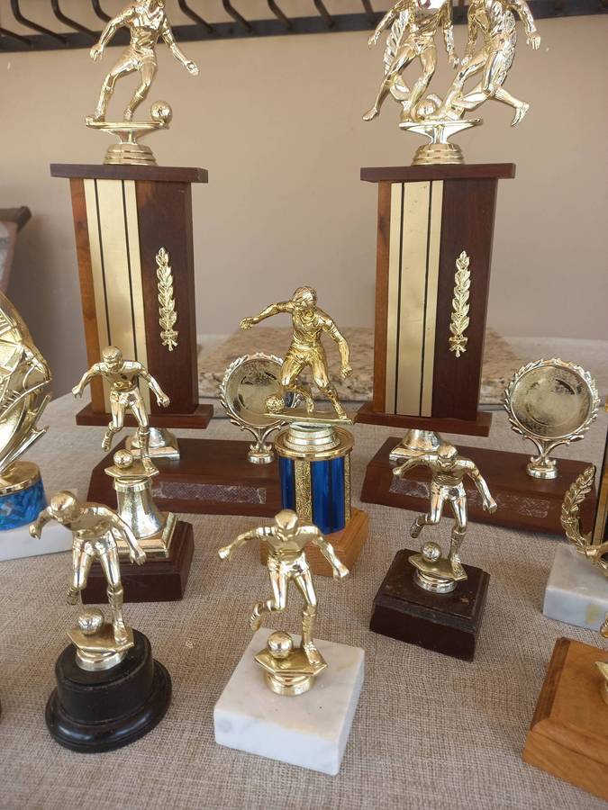 Collection of 13 soccer trophies