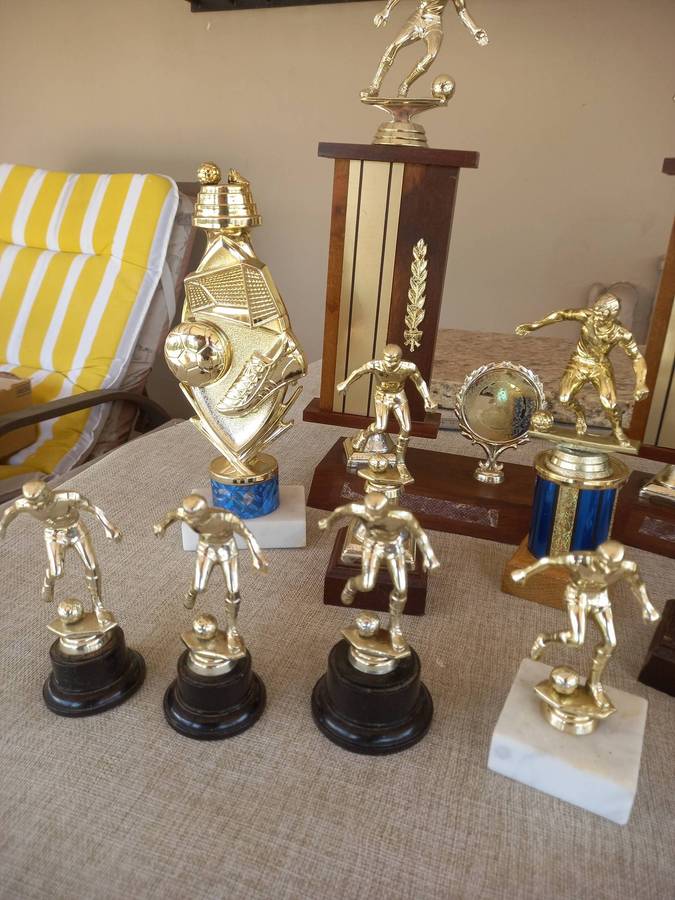 Collection of 13 soccer trophies