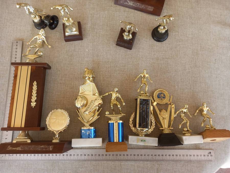 Collection of 13 soccer trophies
