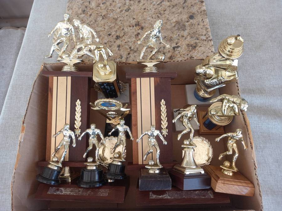 Collection of 13 soccer trophies