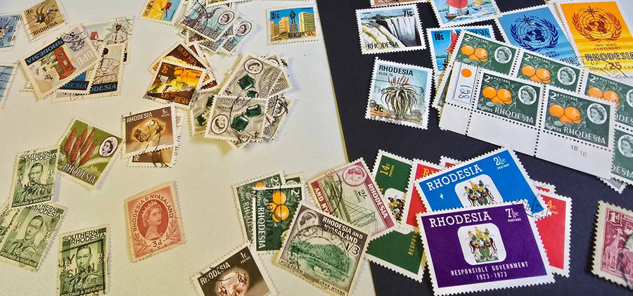 Rhodesia stamp lot with roya re album