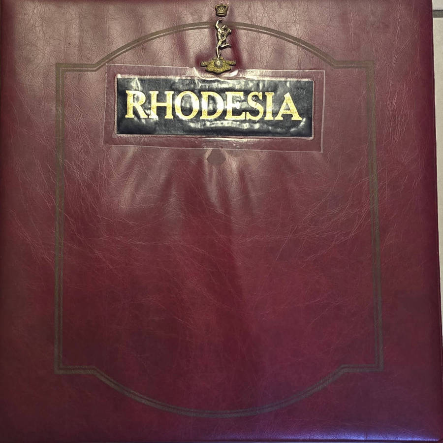 Rhodesia stamp lot with roya re album