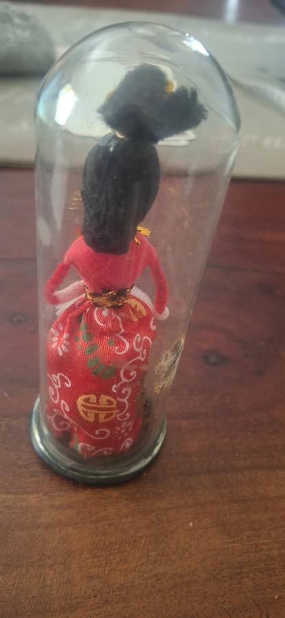 Small Chinese doll in dome
