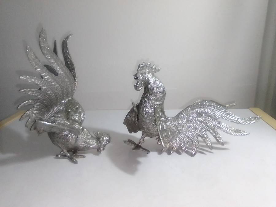 1950's A Vintage pair of fighting roosters. This pair is fierce! Silver plated over cast Brass.