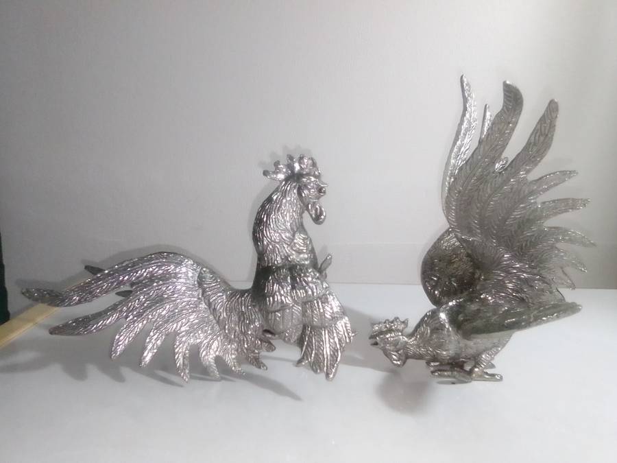 1950's A Vintage pair of fighting roosters. This pair is fierce! Silver plated over cast Brass.