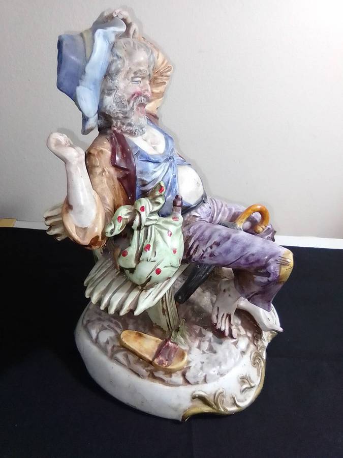 Large Vintage and heavy, Capodimonte Beggar man with umbrella + bag and floppy shoes.