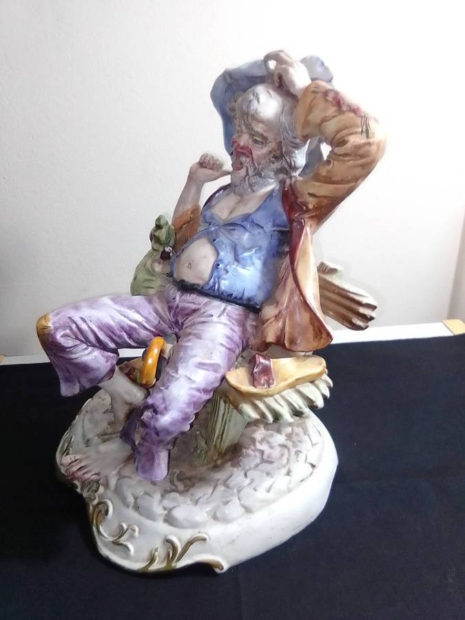 Large Vintage and heavy, Capodimonte Beggar man with umbrella + bag and floppy shoes.