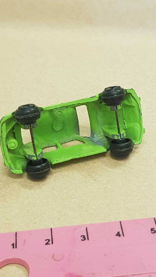Two metal die cast toy cars. VW Bettle and e-type Jaguar.