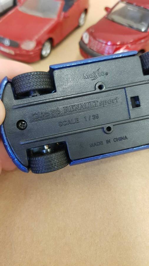 4 Scale model Maisto cars. Renault Clio , Chrysler PT Cruiser ,Mercedes SLK and BMW X5.