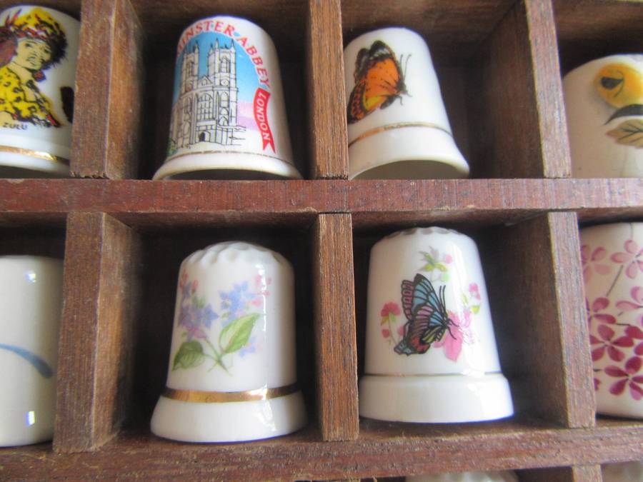 20 BEAUTIFUL PORCELAIN THIMBLESIN SHELF - AS PER SCAN - BID PER ITEM