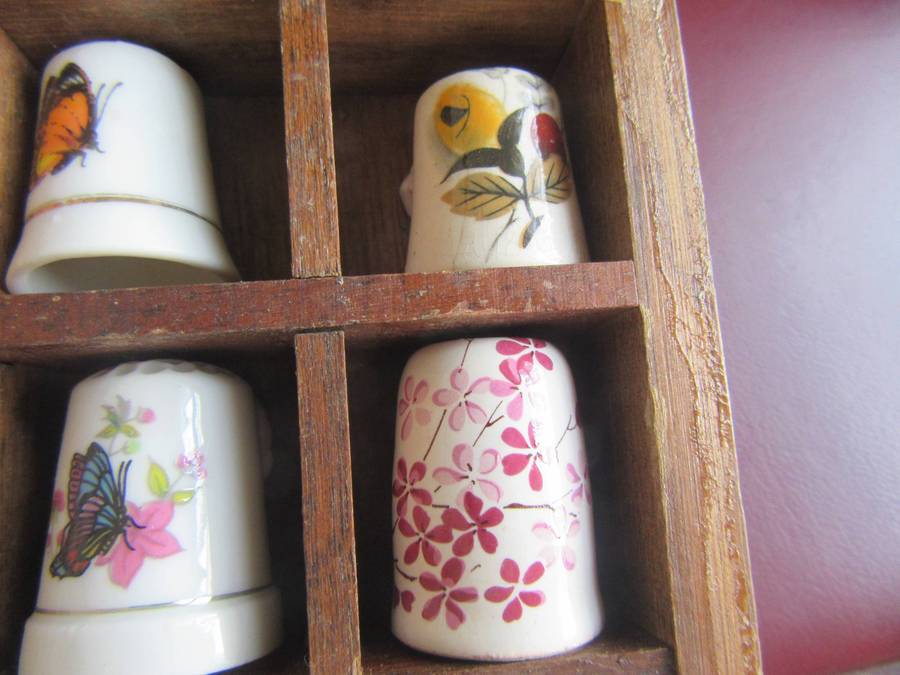 20 BEAUTIFUL PORCELAIN THIMBLESIN SHELF - AS PER SCAN - BID PER ITEM