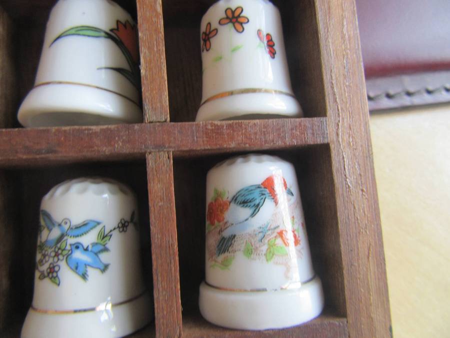 20 BEAUTIFUL PORCELAIN THIMBLESIN SHELF - AS PER SCAN - BID PER ITEM