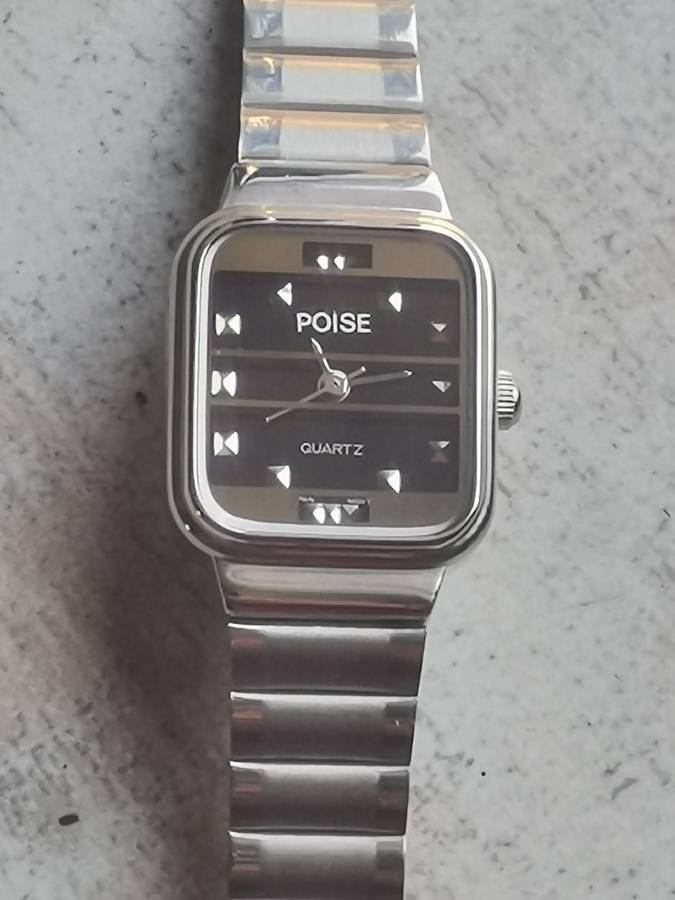 LADIES POISE STAINLESS STEEL WATCH IN EXCELLENT WORKING CONDITION