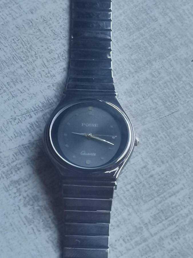 LADIES POISE ALL BLACK STAINLESS STEEL WATCH IN EXCELLENT WORKING CONDITION