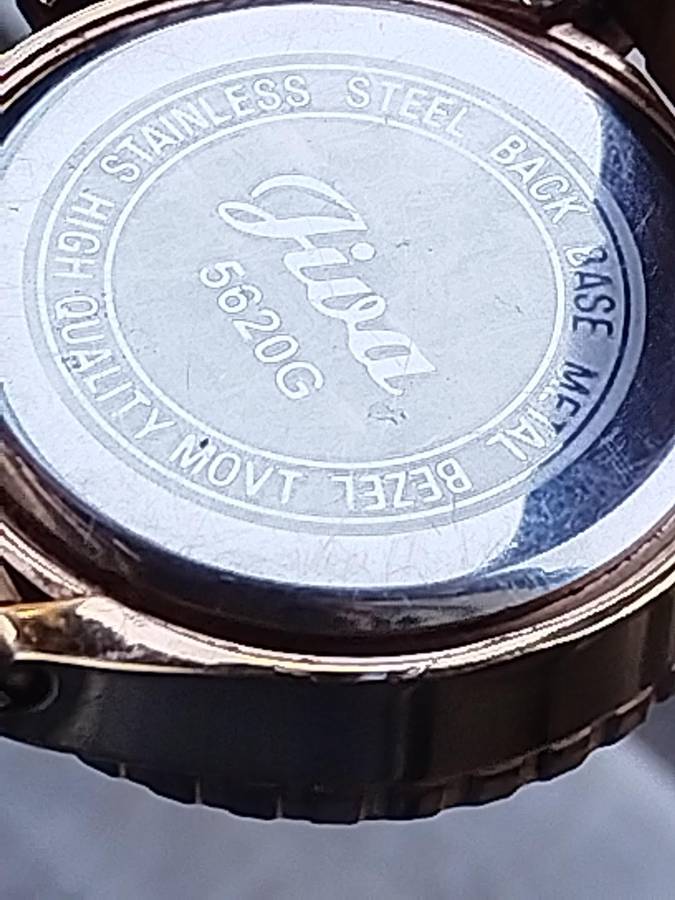 MENS NIXON GOLD PLATED VERY HEAVY WATCH IN EXCELLENT WORKING CONDITION