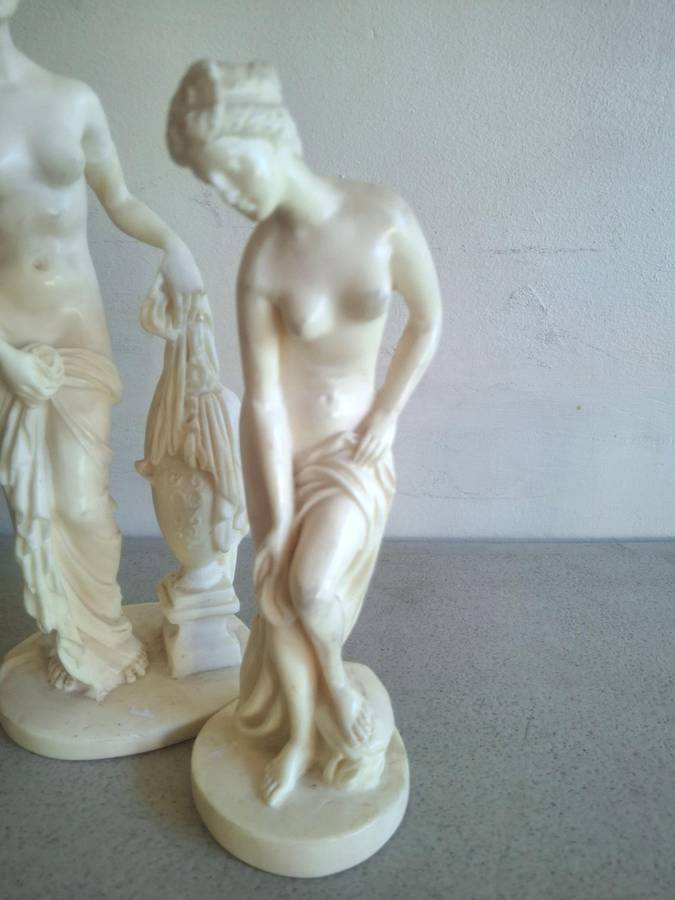 Two resin lady figurines